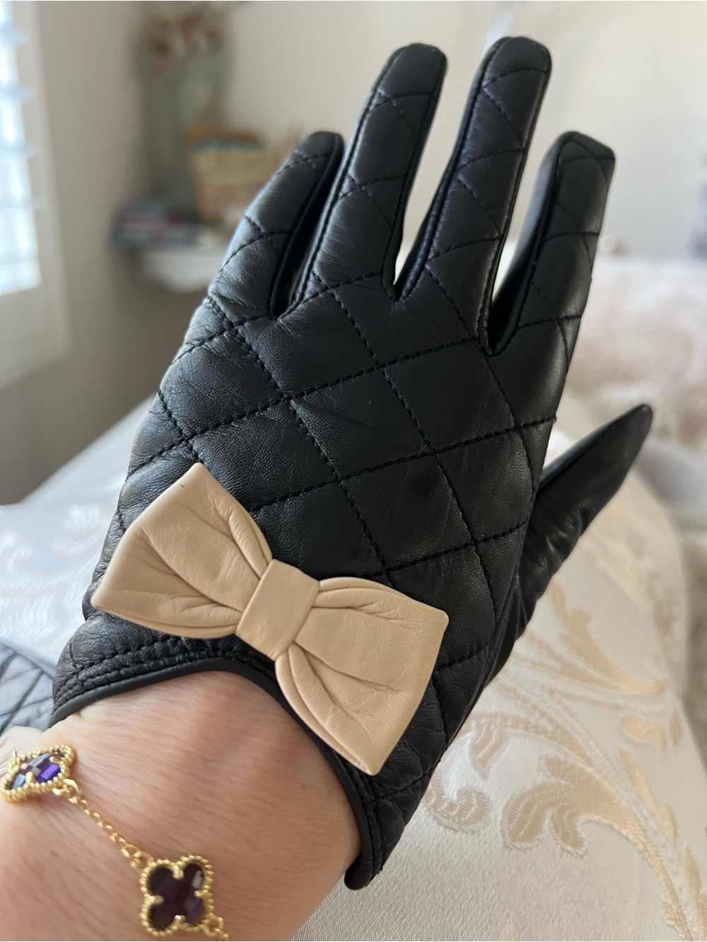 Black Quilted Leather Gloves with Beige Bow Accent